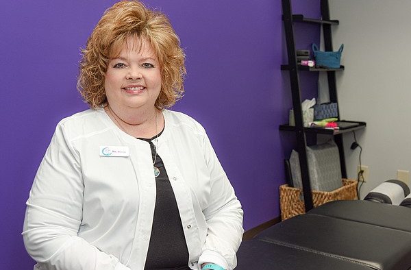 Son's condition inspires woman to become doctor