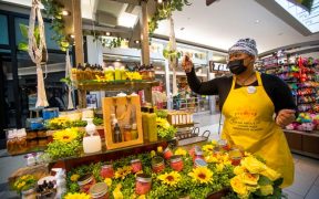 Zion Bradford shows off products Monday, Jan. 10, 2022, at the Yoni Jay kiosk inside the University Park Mall.