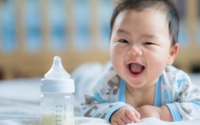 Asian baby with bottle