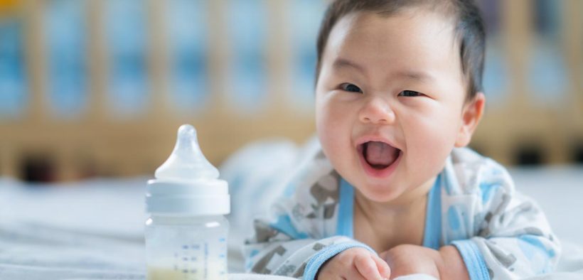 Asian baby with bottle