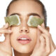 Drinking green tea can be helpful in improving eye bags as the catechins can boost blood flow to the skin and slow aging. You can also apply used, cooled tea bags to the under eyes. (puhhha/Shutterstock)