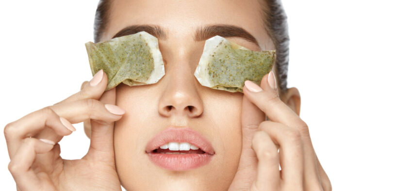 Drinking green tea can be helpful in improving eye bags as the catechins can boost blood flow to the skin and slow aging. You can also apply used, cooled tea bags to the under eyes. (puhhha/Shutterstock)